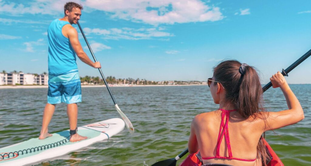 A pair of outdoor enthusiasts enjoy a day on the water after finding the perfect paddleboard and kayak rentals on San Juan Island.