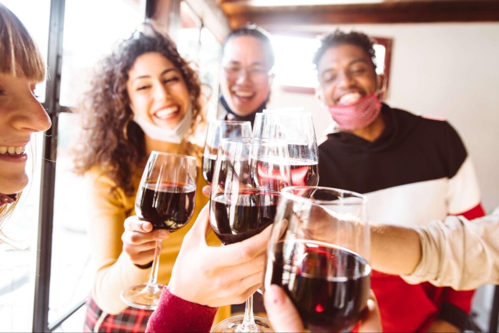 A group of friends give a toast to life at a San Juan Island Winery.